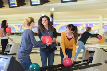 Group of women selecting their bowling balls