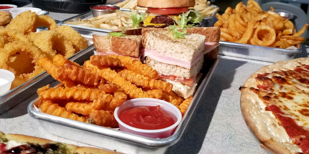 Club sandwich with crinkle cut fries and ketchup